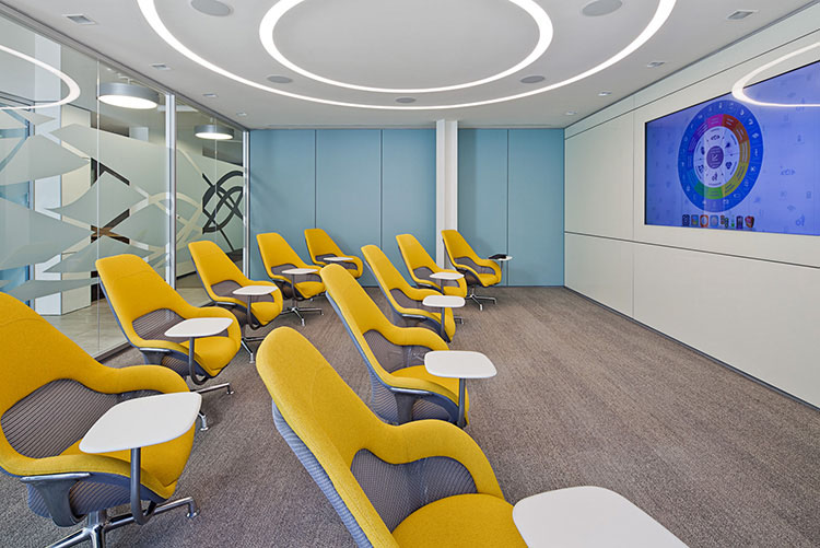 A state-of-the-art presentation room is outfitted with Coalesse SW_1 chairs and DIRTT walls with built-in touch screen technology.