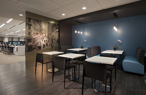 At RW Pressprich & Co., Ted Moudis Associates laminated a semi transparent and sepia toned image to a glass wall between the pantry and trading area. The chosen image harks back to the company’s Wall Street beginnings. Photography: by Jay Rosenblatt