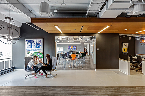 At Initiative Chicago, TMA used a white “wood look” porcelain tile flooring installed at angles to achieve the look of real white washed wood, providing a more casual, residential look. Photography: by Magda Biernat