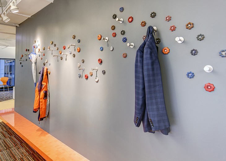 At full-service media agency BPN’s Chicago office, colorful faucet spigots serve as a piece of art, but also have a practical purpose, doubling as a place for the staff to hang their jackets. Photography: by Brent Gollnick