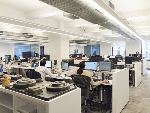 UNOPS’ 3,700 square foot open plan office area with 70 workstations features adjustable height desks and a LED lighting system that adjusts to the amounts of natural daylight harvested from multiple windows. Photo: by Sasha Maslov
