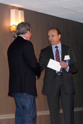 New president of the BIFMA Board, Sylvain Garneau presents outgoing president Dan Tuohy with a token of the board’s appreciation for his service.