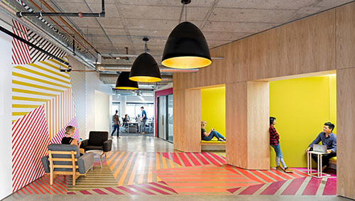 Yelp offices, abstracting the visual patterns of Dutch tulip fields as seen from the air and turning them into Mondrian-like wall art in a simple space (San Francisco, California, 2015). Photo: Jasper Sanidad