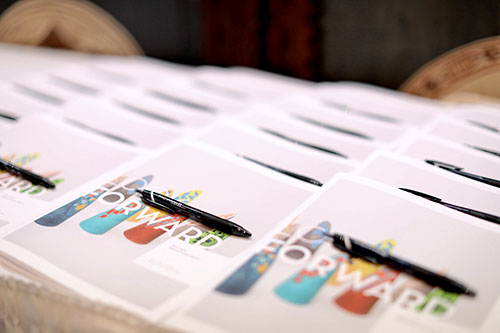 The workbooks lined up for participants to rate the new products.